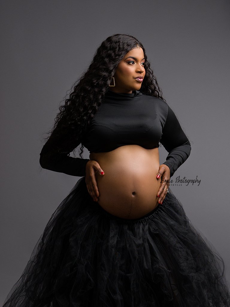 High-end studio maternity photoshoot creating timeless pregnancy portraits