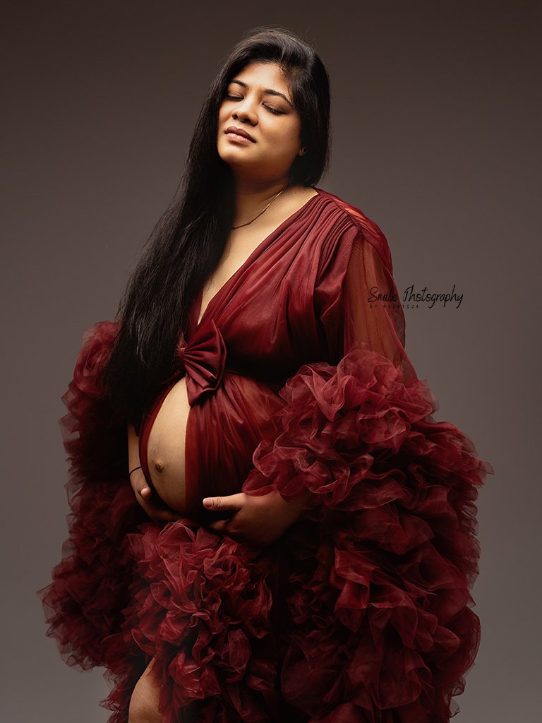 Beautiful pregnancy portrait focusing on the connection between mother and unborn baby