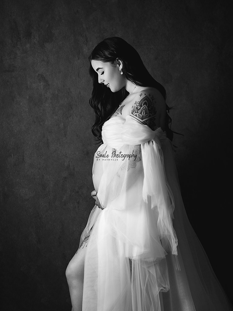 Soft and timeless maternity image created with professional studio lighting